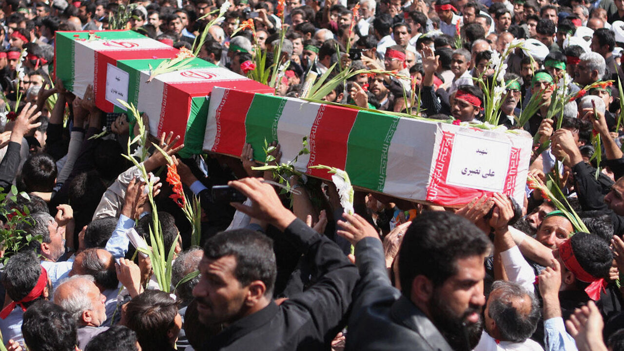 Iranians carry the coffins at the Shah Cheragh shrine of Shiraz on April 15, 2008 during the funeral of the people who were killed in a mosque blast on April 12 in the southern city of Shiraz. 