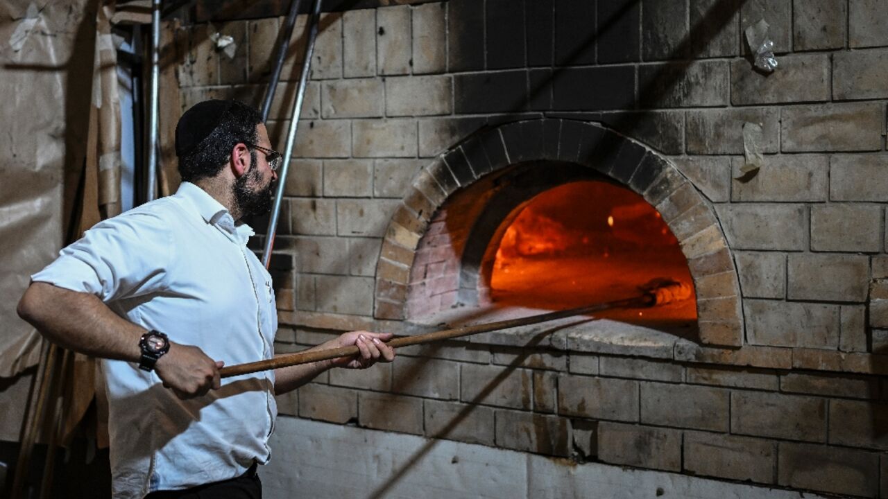 An Ultra-Orthodox Jew prepares Matzoth, unleavened bread, at a Jerusalem bakery on the eve of Passover