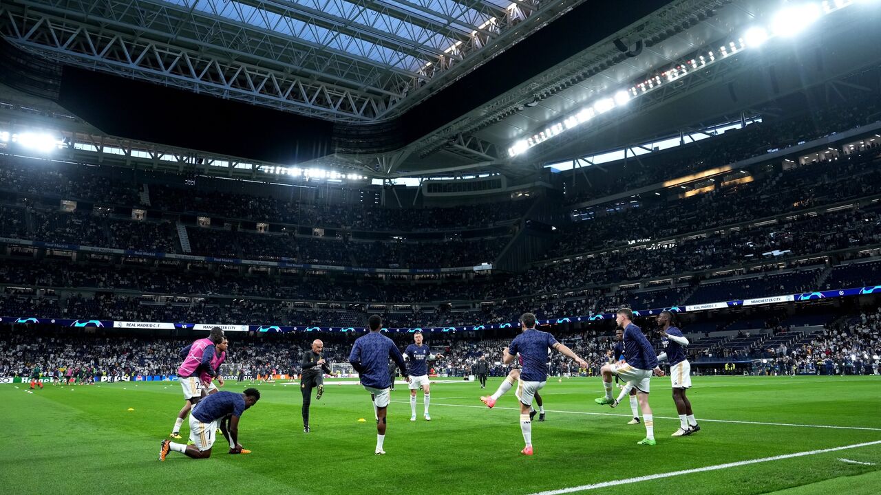A general view as players of Real Madrid warm up prior to the UEFA Champions League quarter-final first leg match between Real Madrid CF and Manchester City at Santiago Bernabeu Stadium on April 09, 2024, in Madrid, Spain.