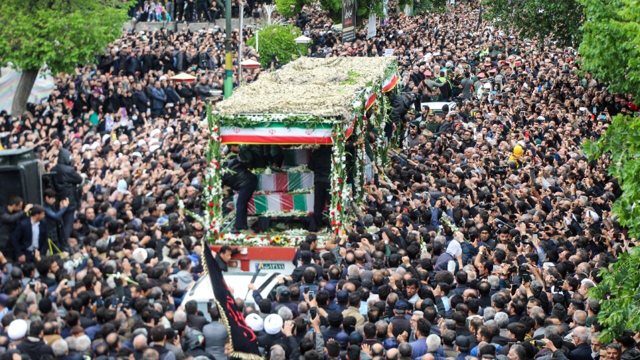 A truck carrying the bodies of Iranian president Ebrahim Raisi and seven members of his entourage winds its way through huge crowds in the northwestern city of Tabriz, where he was headed when he died in a Sunday helicopter crash