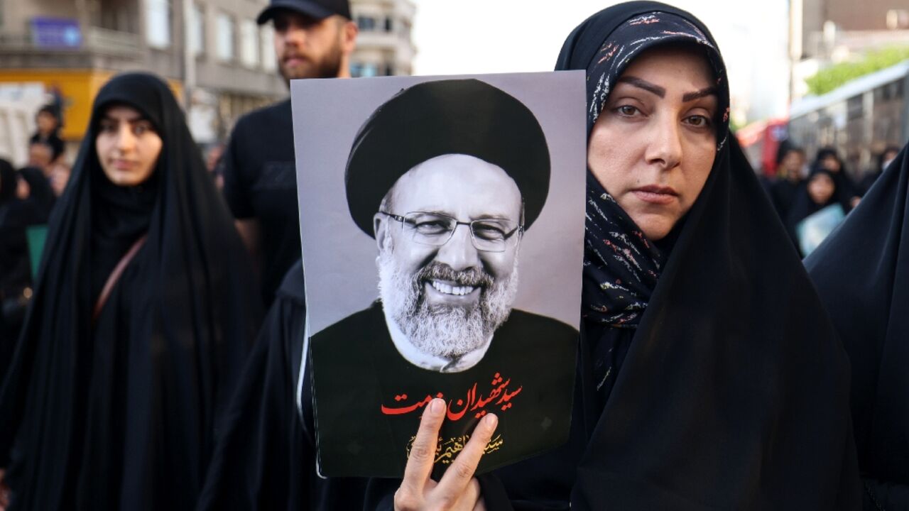 Iranians pay their last respects to president Ebrahim Raisi and seven members of  his entourage killed in a Sunday helicopter crash