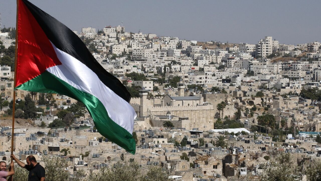 A Palestinian flag on a hilltop near the southern West Bank city of Hebron