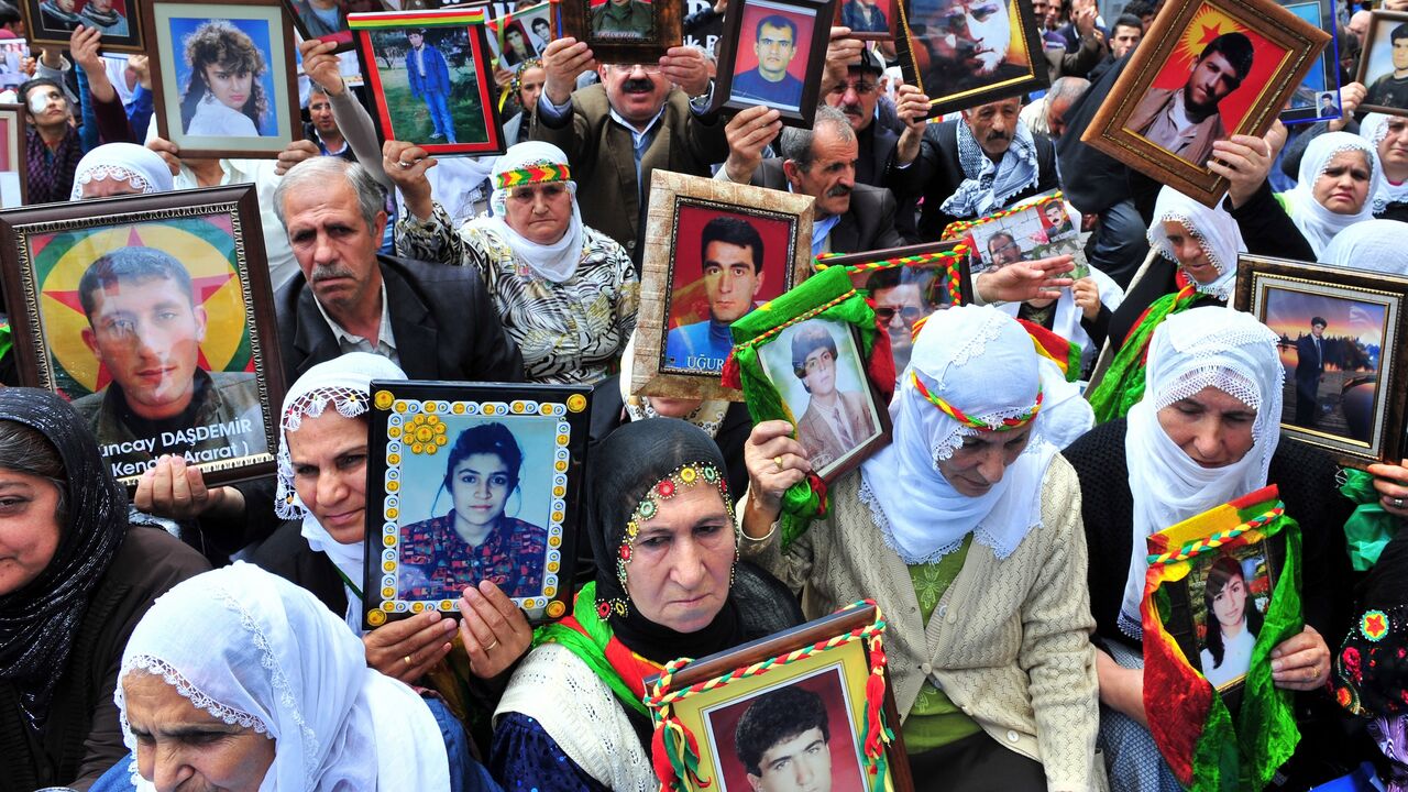 Kurdish women hold portraits of their missing sons on May 18, 2011, during a demonstration in Istanbul against the recent killing of 12 Kurdish rebels by security forces.