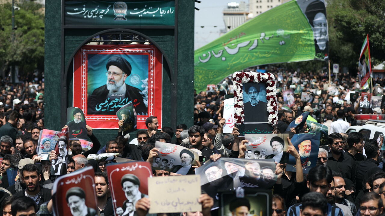 Iranian mourners attend the funeral of late president Ebrahim Raisi in the city of Mashhad on May 23, 2024.