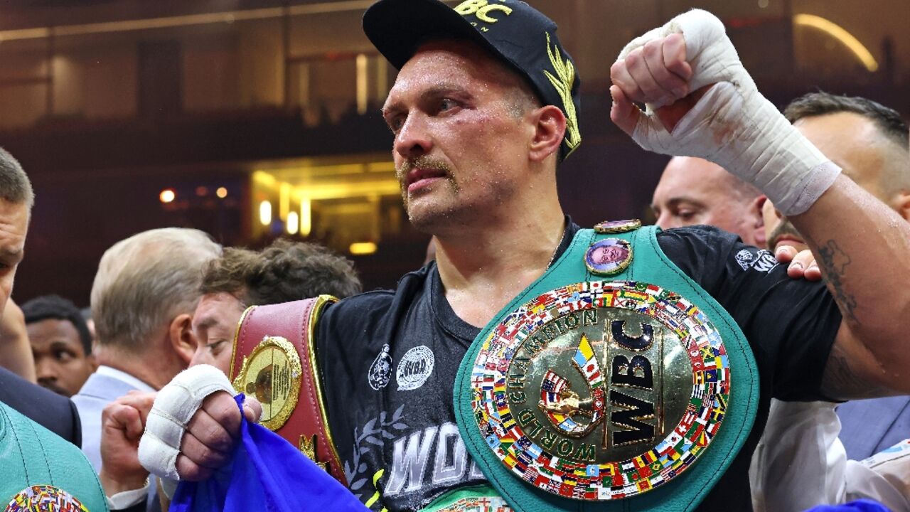 Ukraine's Oleksandr Usyk celebrates his victory over Britain's Tyson Fury for the undisputed heavyweight world title