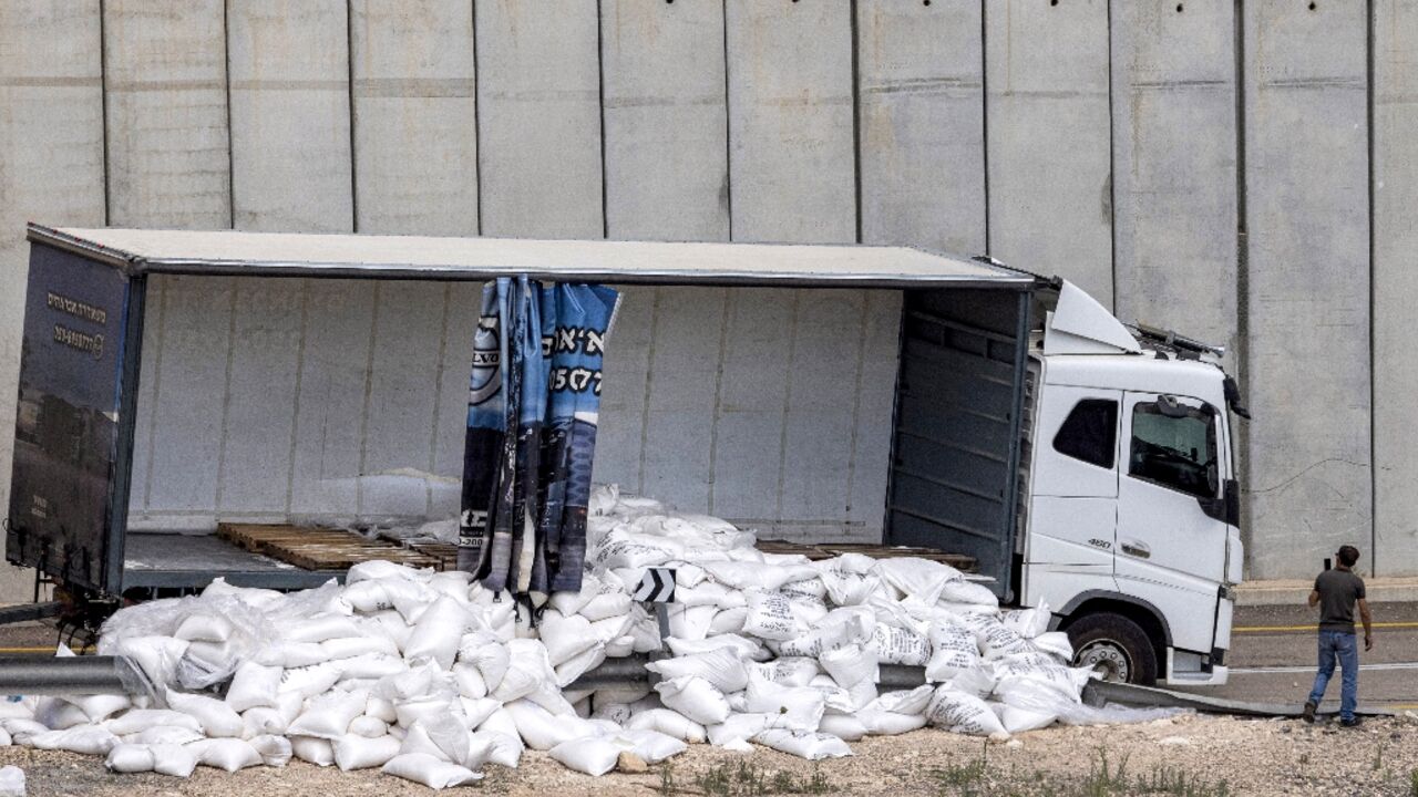 A truck with scattered aid supplies for Gaza after it was vandalised by right-wing Israeli activists near the West Bank village of Shekef on May 13, 2024