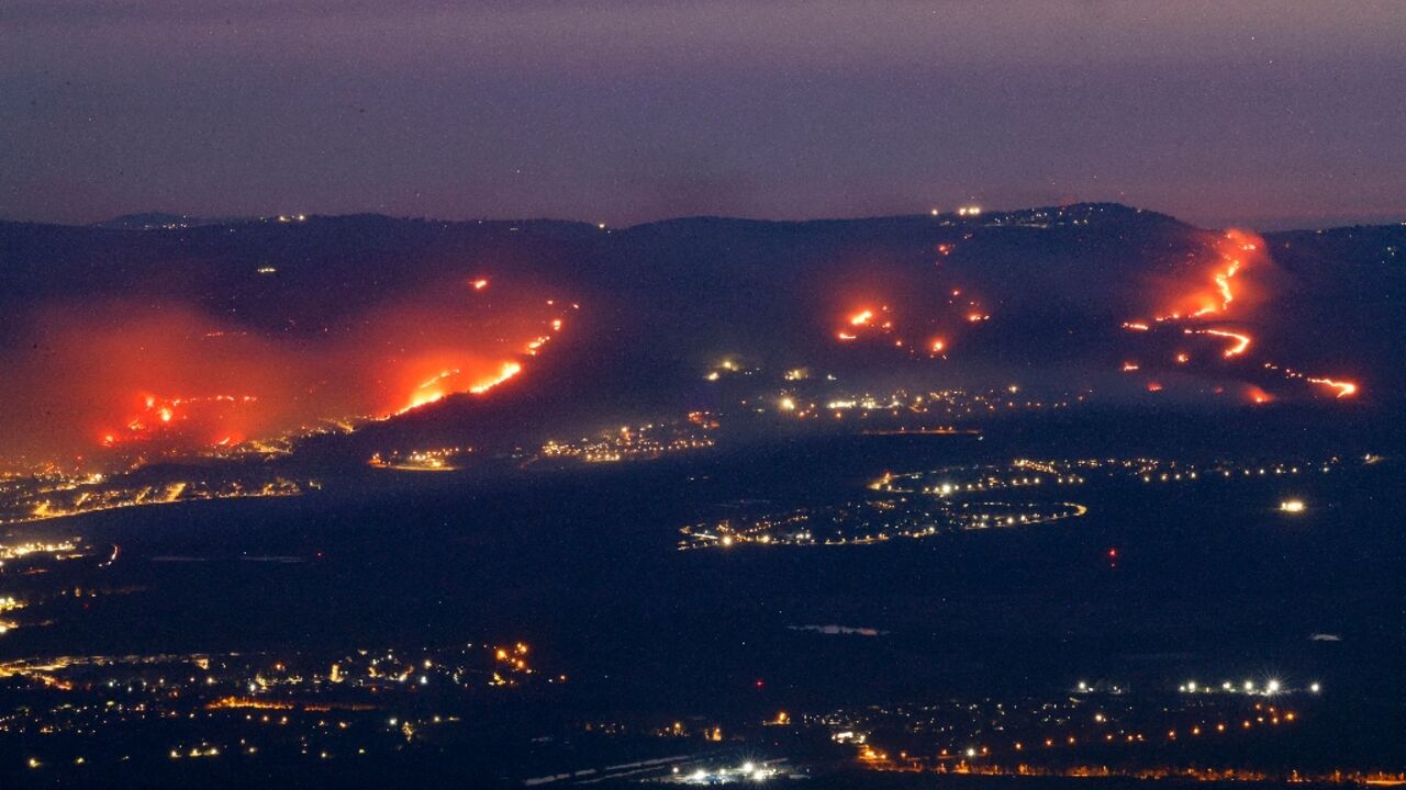 Fires burn in northern Israel as a result of rockets launched from Lebanon amid cross-border clashes between Israeli troops and Hezbollah