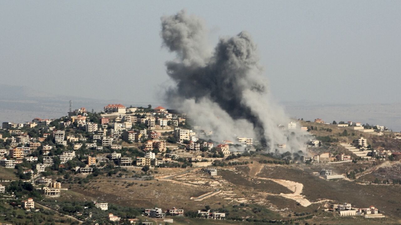 Smoke billows from the site of an Israeli strike on the southern Lebanese village of Khiam near the border