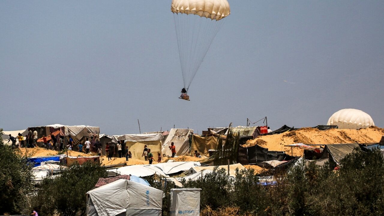 Humanitarian aid dropped on Khan Yunis falls near tents sheltering Palestinians displaced by conflict 
