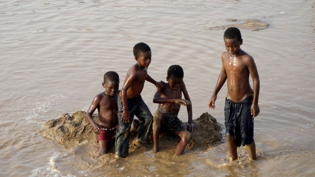 Children play in the waters of the Gash River some 600 kilometres from Sudanese capital Khartoum on June 6, 2024
