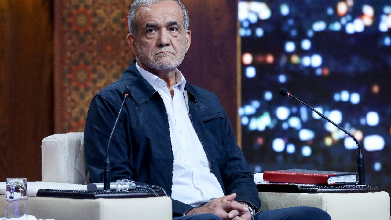 This handout photo made available by the Islamic Republic of Iran Broadcasting (IRIB) shows presidential candidate Masoud Pezeshkian during a debate at the Iran state television studio in Tehran