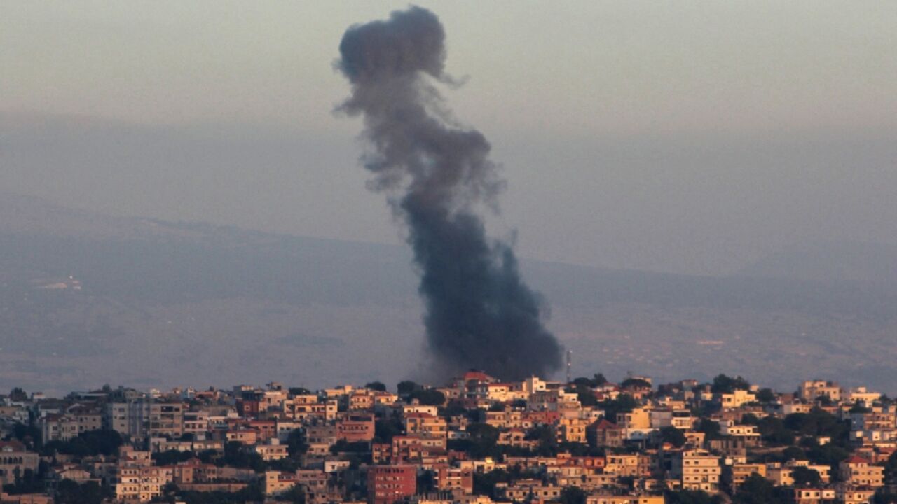 Smoke billows from the site of an Israeli airstrike targeting a southern Lebanese village