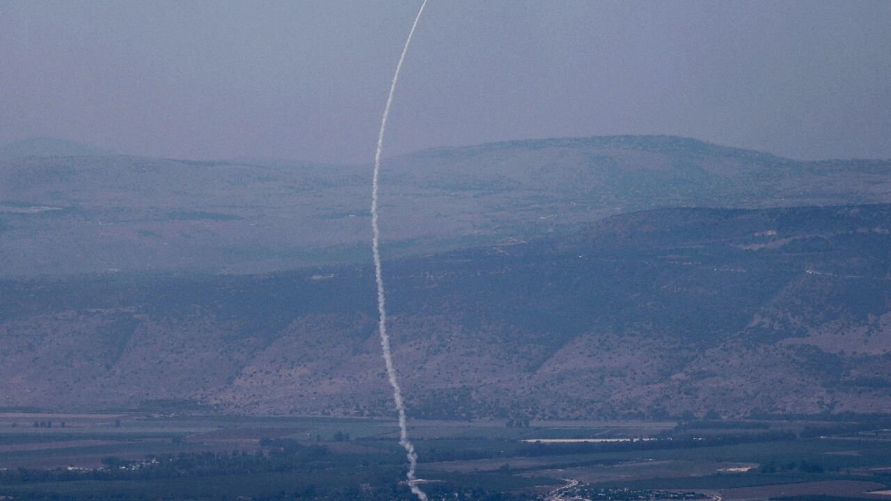A rocket fired from southern Lebanon is intercepted by Israel's Iron Dome air defence system over northern Israel