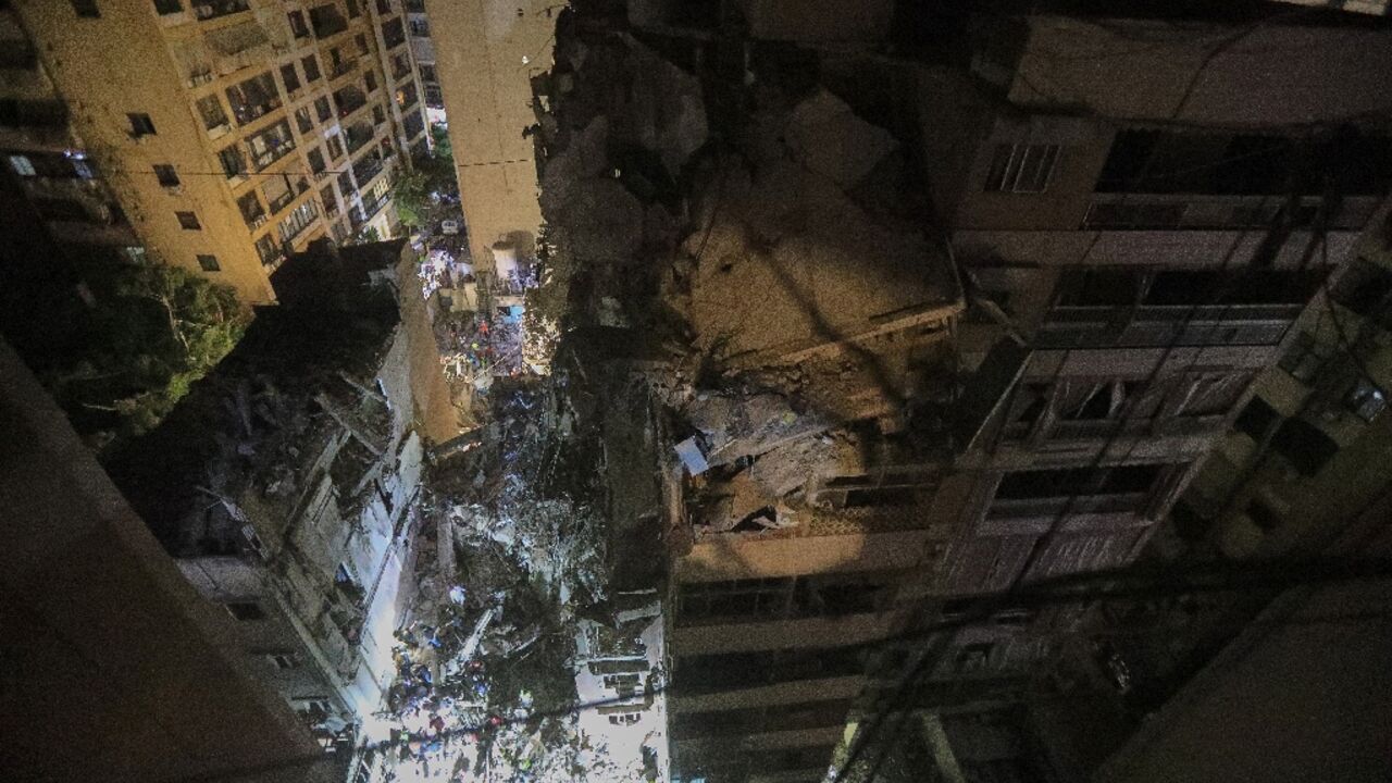 The destroyed top floors of an eight storey building in Beirut hit by an Israeli strike that targeted a top Hezbollah commander