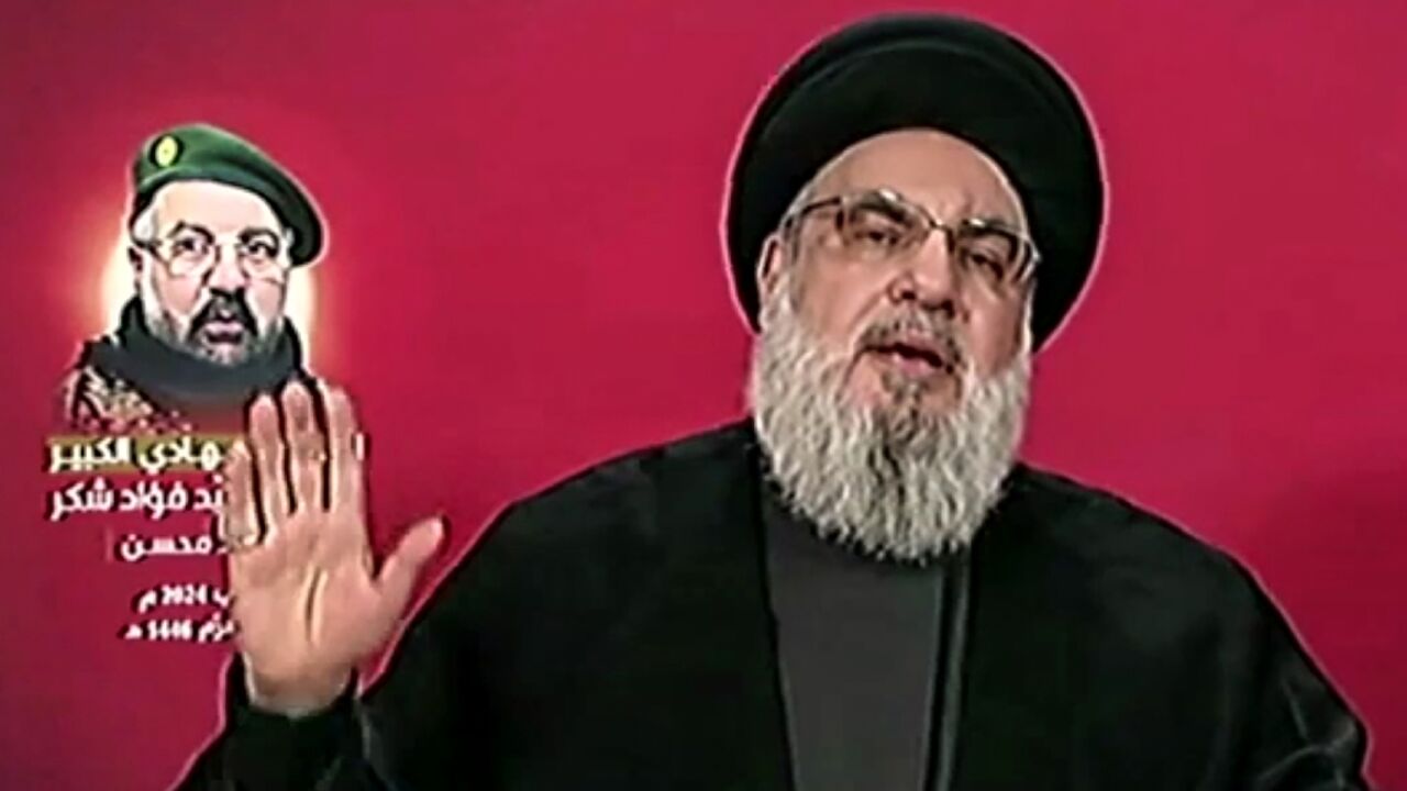 Hezbollah leader Hassan Nasrallah addresses mourners at the funeral of top military commander Fuad Shukr by television from an undisclosed location in Lebanon