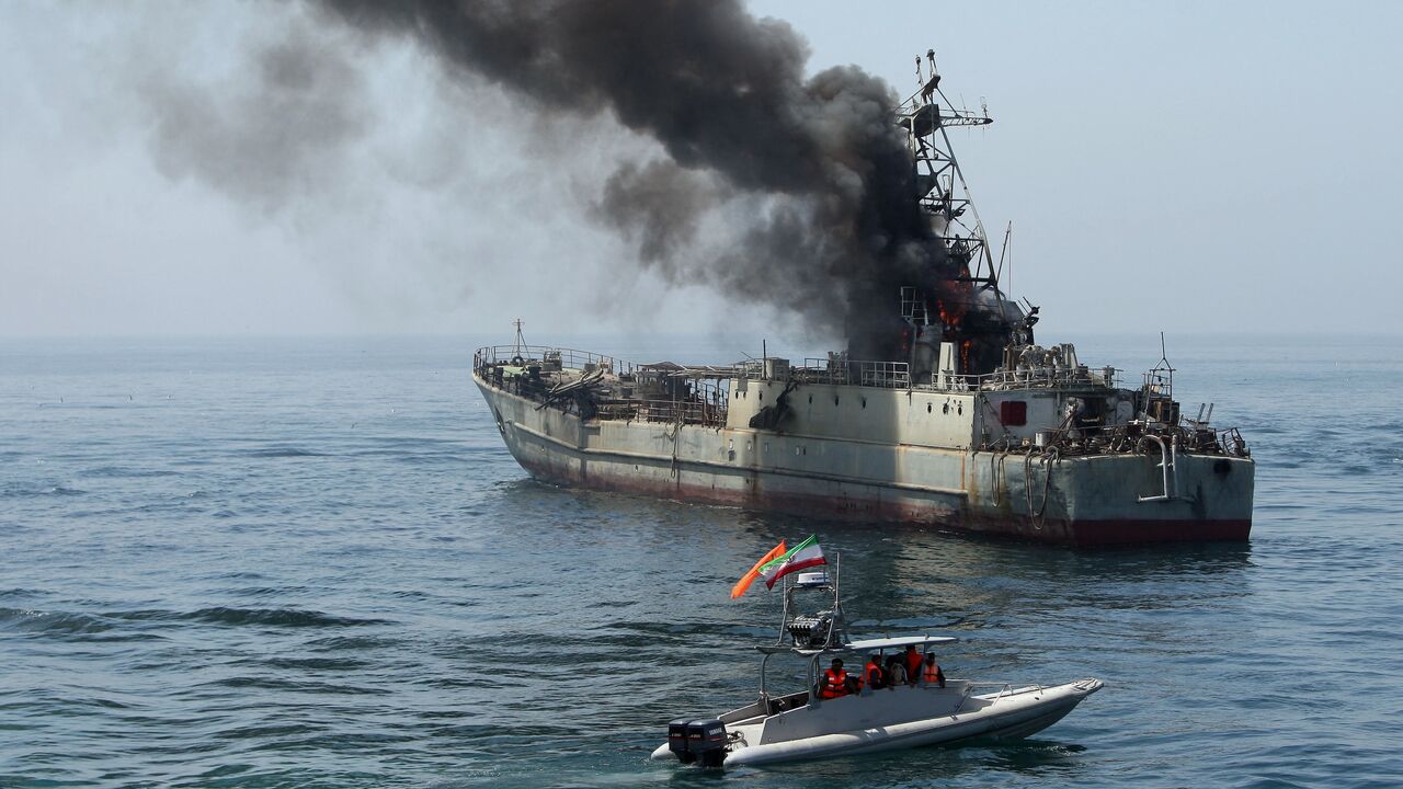 Iran's elite Revolutionary Guard boats attack a naval vessel during a three-day military drill in the Gulf on April 22, 2010. 