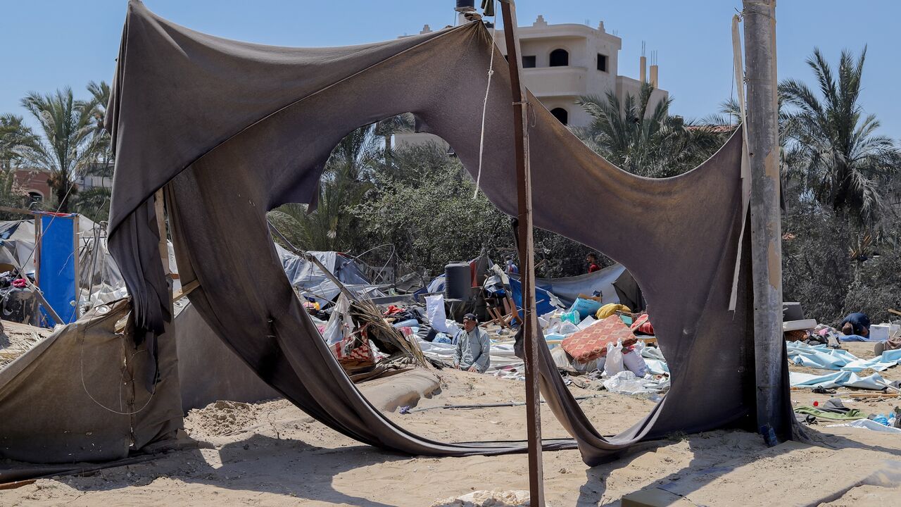 A Palestinian praysfollowing an Israeli military strike on the al-Mawasi camp for internally displaced people (IDP), near the city of Khan Younis, southern Gaza Strip, July 13, 2024.