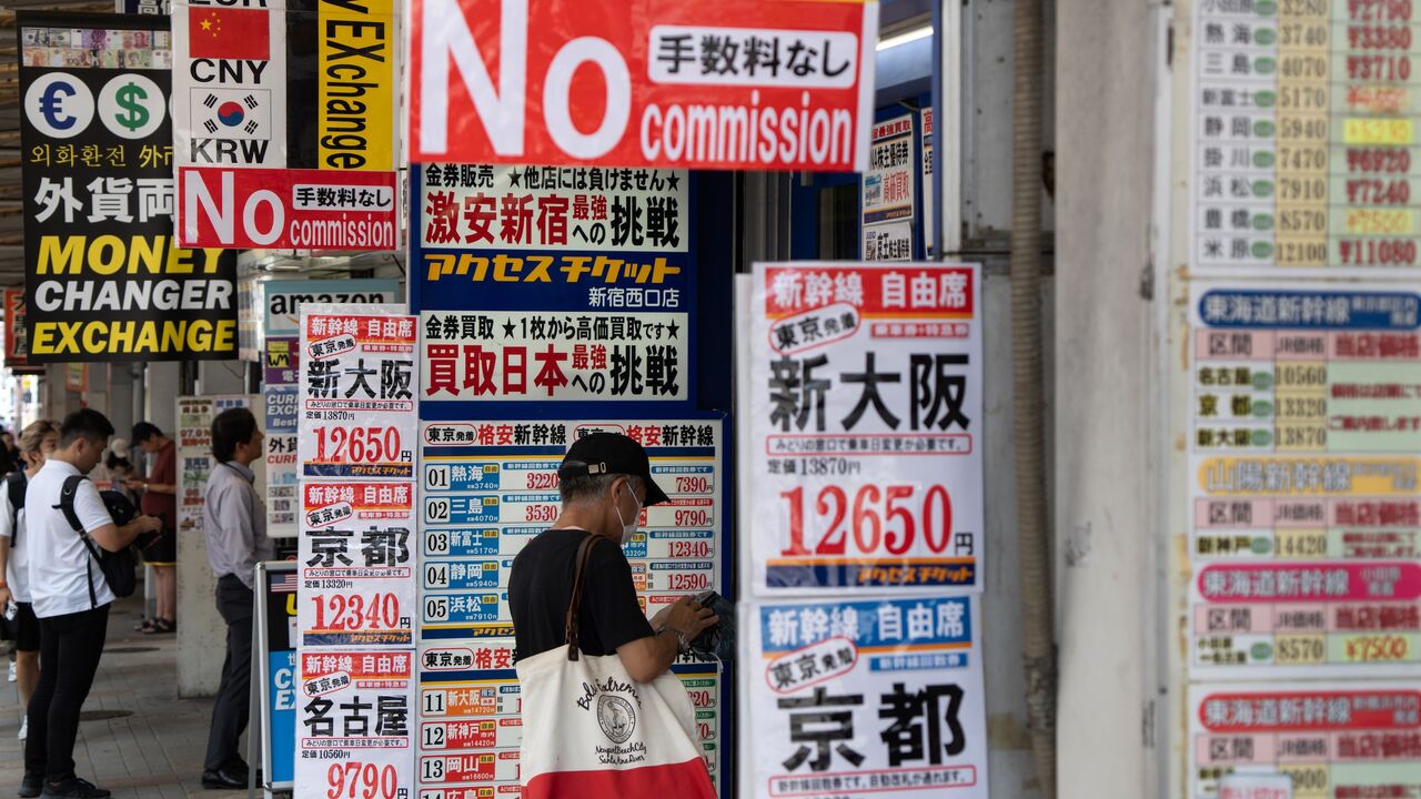 Customers wait outside currency exchange stores on Aug. 5, 2024, in Tokyo, Japan.