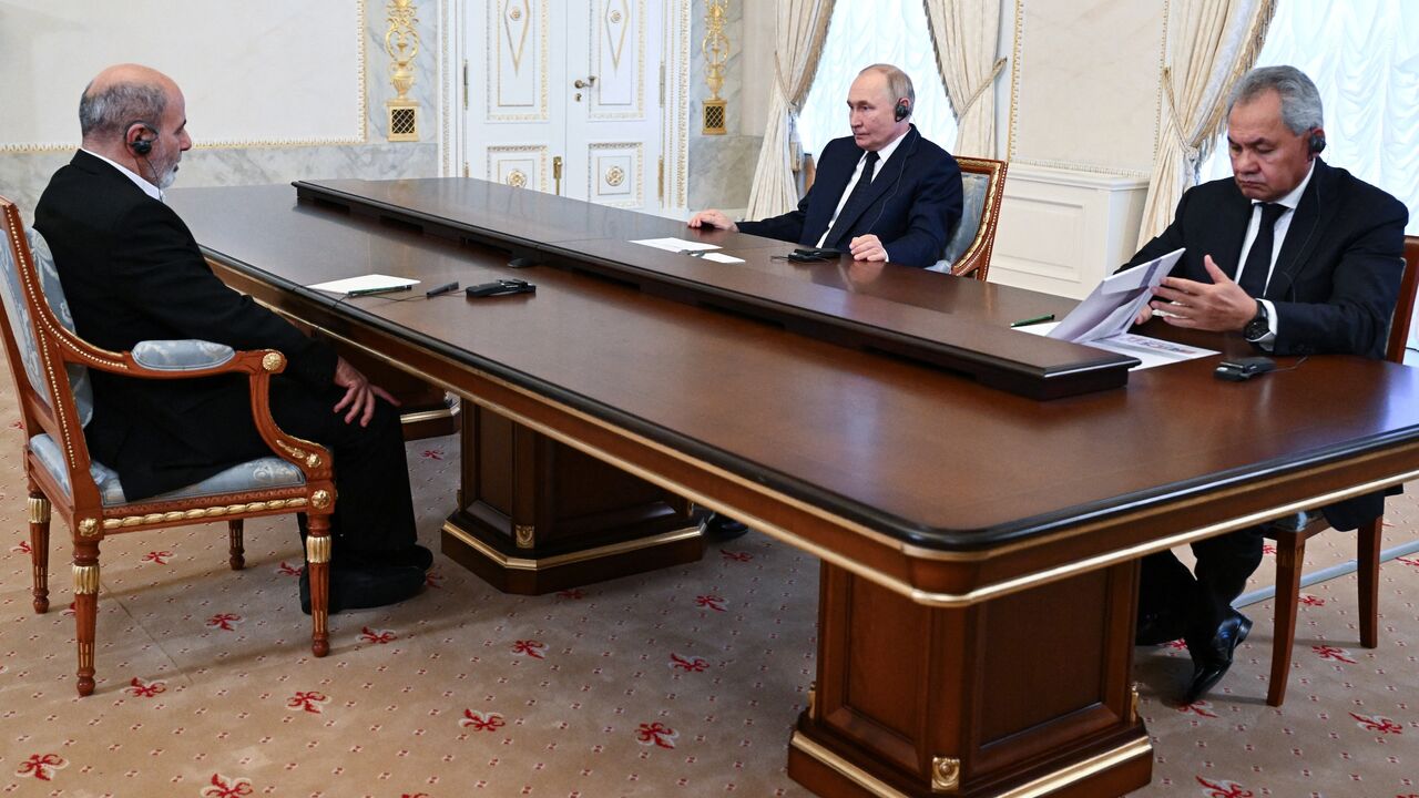 Russia's President Vladimir Putin, accompanied by the country's Security Council Secretary Sergei Shoigu, meets with Ali Akbar Ahmadian, secretary of Iran's Supreme National Security Council, in Saint Petersburg, on Sept. 12, 2024.