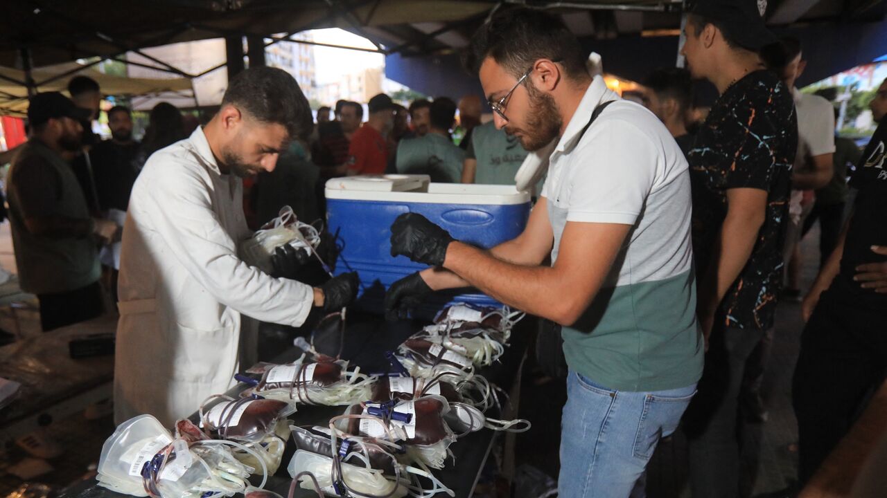 Medics collect blood donations in Beirut's southern suburb on September 17, 2024, after explosions hit locations in several Hezbollah strongholds around Lebanon amid ongoing cross-border tensions between Israel and Hezbollah fighters. 