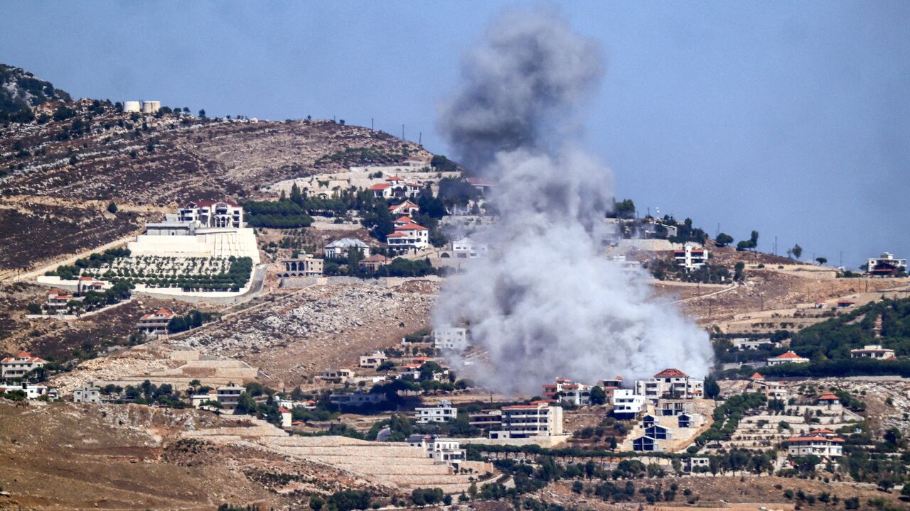 A cloud of smoke erupts during an Israeli airstrike on the village of Sujud in southern Lebanon on Sept. 25, 2024. 