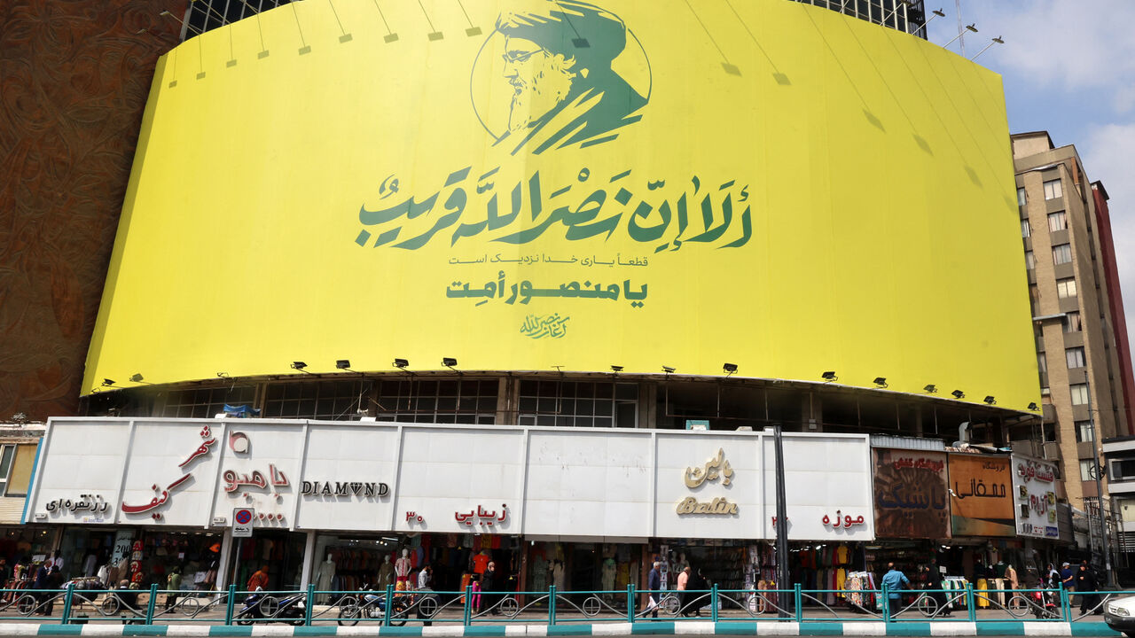 A large banner bearing a picture of slain Lebanese Hezbollah leader Hassan Nasrallah hangs on the facade of a building in central Tehran, two days after his targeted assassination by Israeli forces in Beirut's southern suburbs, on September 29, 2024. Hezbollah confirmed Nasrallah's death after the Israeli military said he had been killed in an air strike on September 27 on the southern suburbs of Beirut, the Iran-backed group's main bastion. (Photo by ATTA KENARE / AFP) (Photo by ATTA KENARE/AFP via Getty I