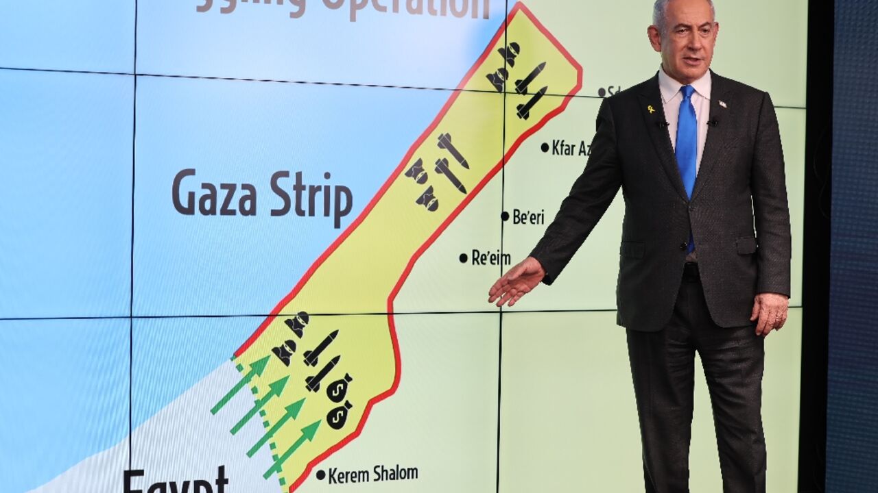 Israel's Prime Minister Benjamin Netanyahu stands in front of a map of the Gaza Strip as he speaks during a press conference on September 4, 2024