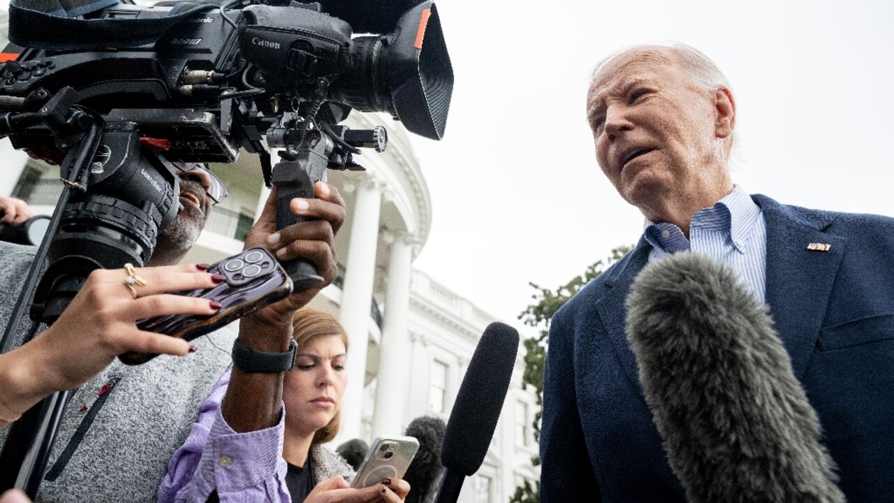 US President Joe Biden speaks to the media prior to departing on Marine One from the South Lawn of the White House in Washington, DC, on October 3, 2024, as he travels to Florida and Georgia to view damage from Hurricane Helene.