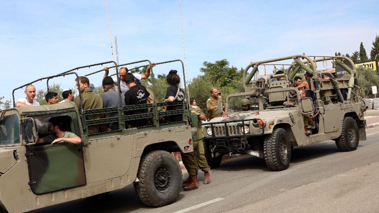 Israeli reservists are transported to their base outside Tel Aviv on October 7, 2023, the day the Gaza war erupted