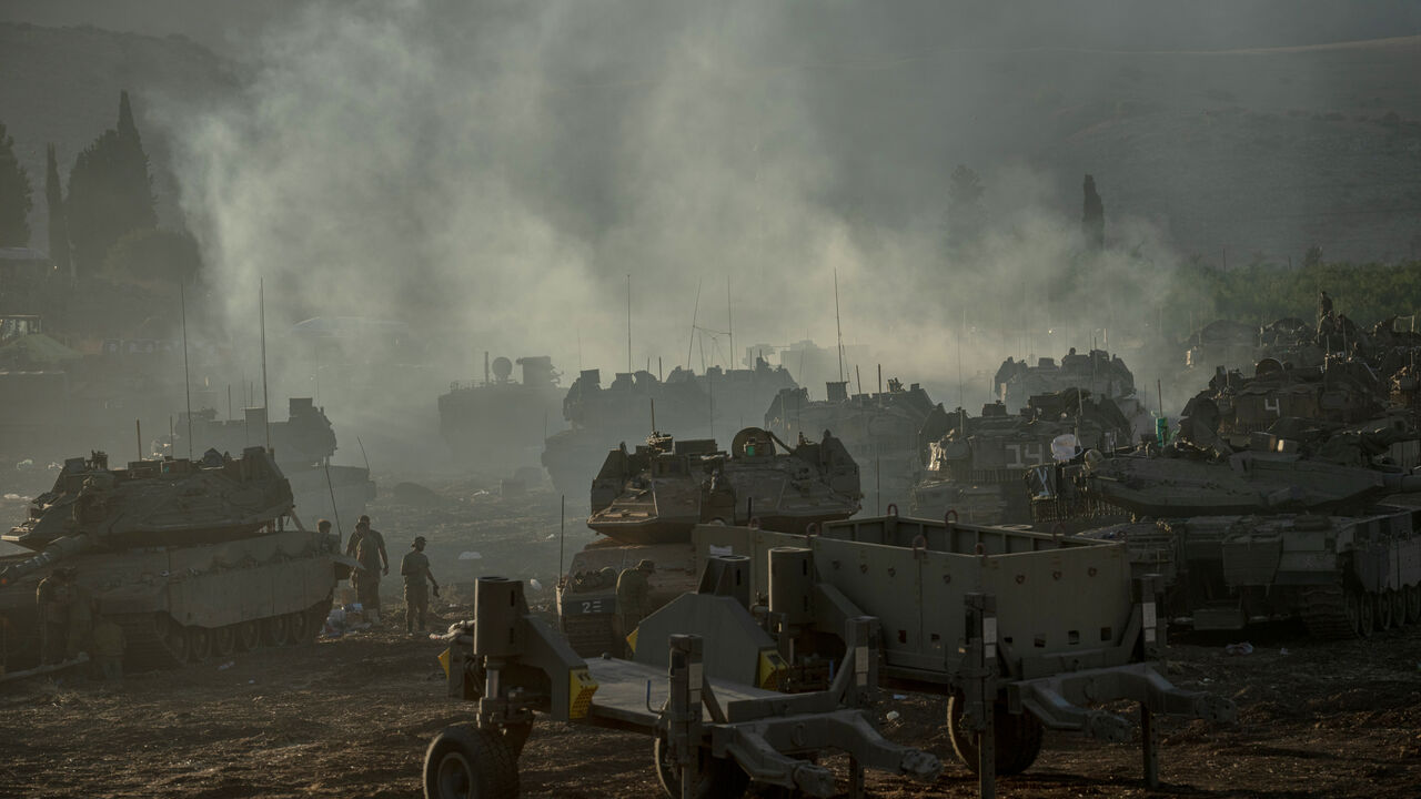 ISRAEL - LEBANESE BORDER, UPPER GALILEE, - SEPTEMBER 30: Israeli tanks and APC's gather by the Israeli - Lebanese border on September 30, 2024. Amid Israel's escalating campaign against Hezbollah in Lebanon, speculation continues over a possible ground offensive. Last week, Israeli Chief of Staff Lt. Gen. Herzi Halevi said Israel's recent airstrikes were designed to "prepare the ground for your possible entry and to continue degrading Hezbollah." (Photo by Erik Marmor/Getty Images)