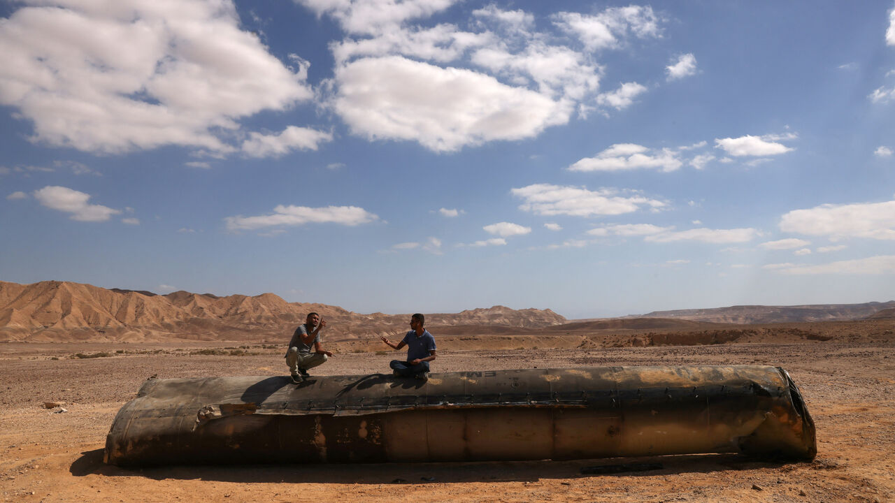 This picture shows the remains of an Iranian missile on the ground in the Negev desert near Arad, on October 2, 2024, in the aftermath of an Iranian missile attack on Israel. Israel vowed to make Iran "pay" for firing a barrage of missiles at its territory, with Tehran warning on October 2 it would launch an even bigger attack it is targeted. (Photo by Menahem KAHANA / AFP) (Photo by MENAHEM KAHANA/AFP via Getty Images)