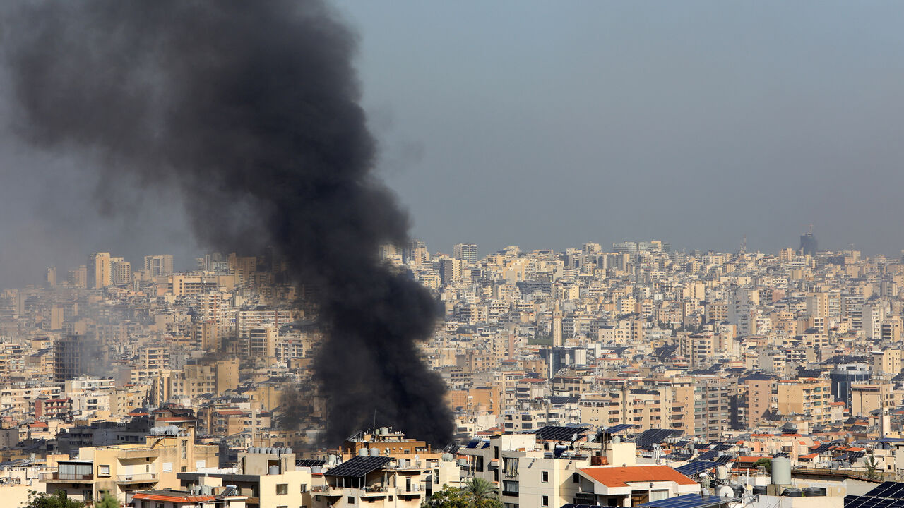 Smoke rises from buildings hit in an overnight Israeli airstrike that targeted the southern suburbs of Beirut, Lebanon, Oct. 3, 2024.