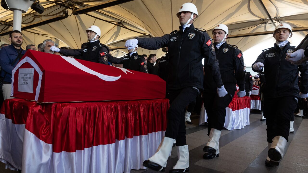 Members of the police carry the coffins of victims of the attack that occurred on Oct. 23, 2024, at the Turkish Aviation Company facility, during a funeral ceremony on Oct. 24, 2024, in Ankara, Turkey.