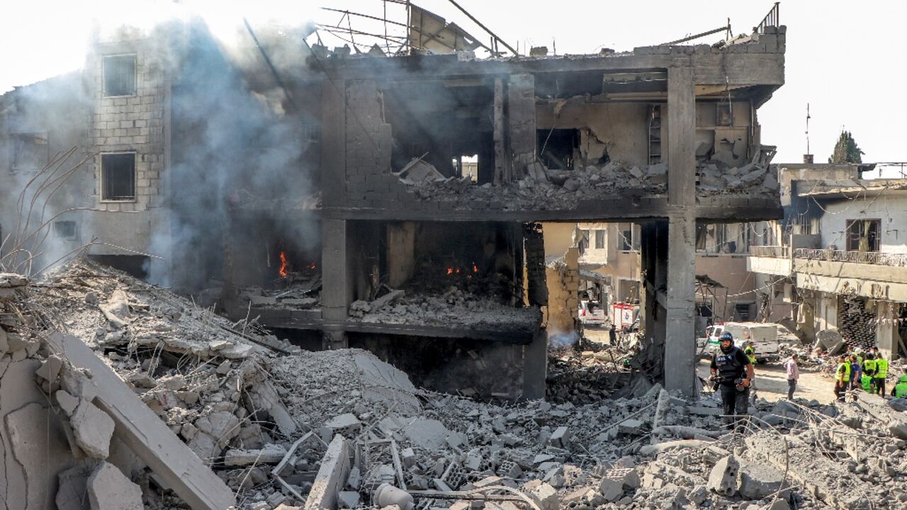 The rubble of a building destroyed by Israeli air strike on the village of Qana in southern Lebanon 