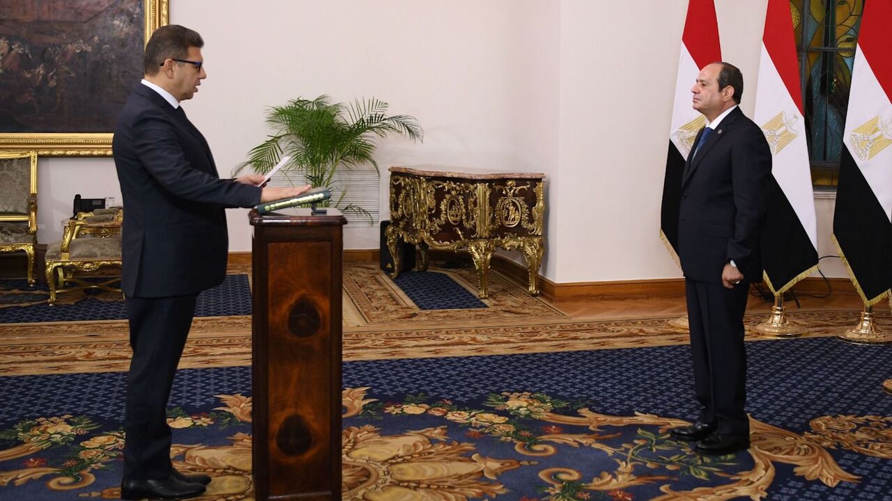 Egypt's new intelligence chief, Maj. Gen. Hassan Mahmoud Rashad (L), is sworn in in front of Egypt's president, Abdel Fattah al-Sisi (R), in Cairo on Oct. 16, 2024.