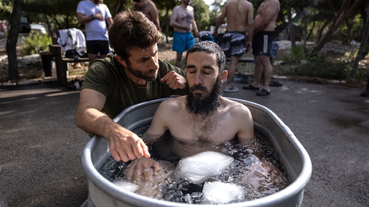 The volunteer Israeli rescue workers, whose role is to collect the remains of the dead, have begun attending group healing sessions