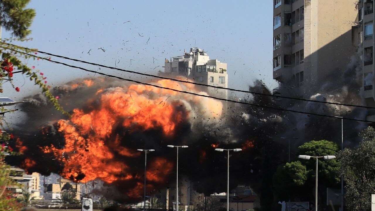 A ball of fire erupts as an Israeli strike hits a building in the Beirut southern suburb of Ghobeiri.