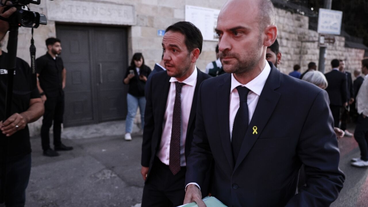 French Foreign Minister Jean-Noel Barrot (R) walks away from the Eleona Domain compound in Jerusalem