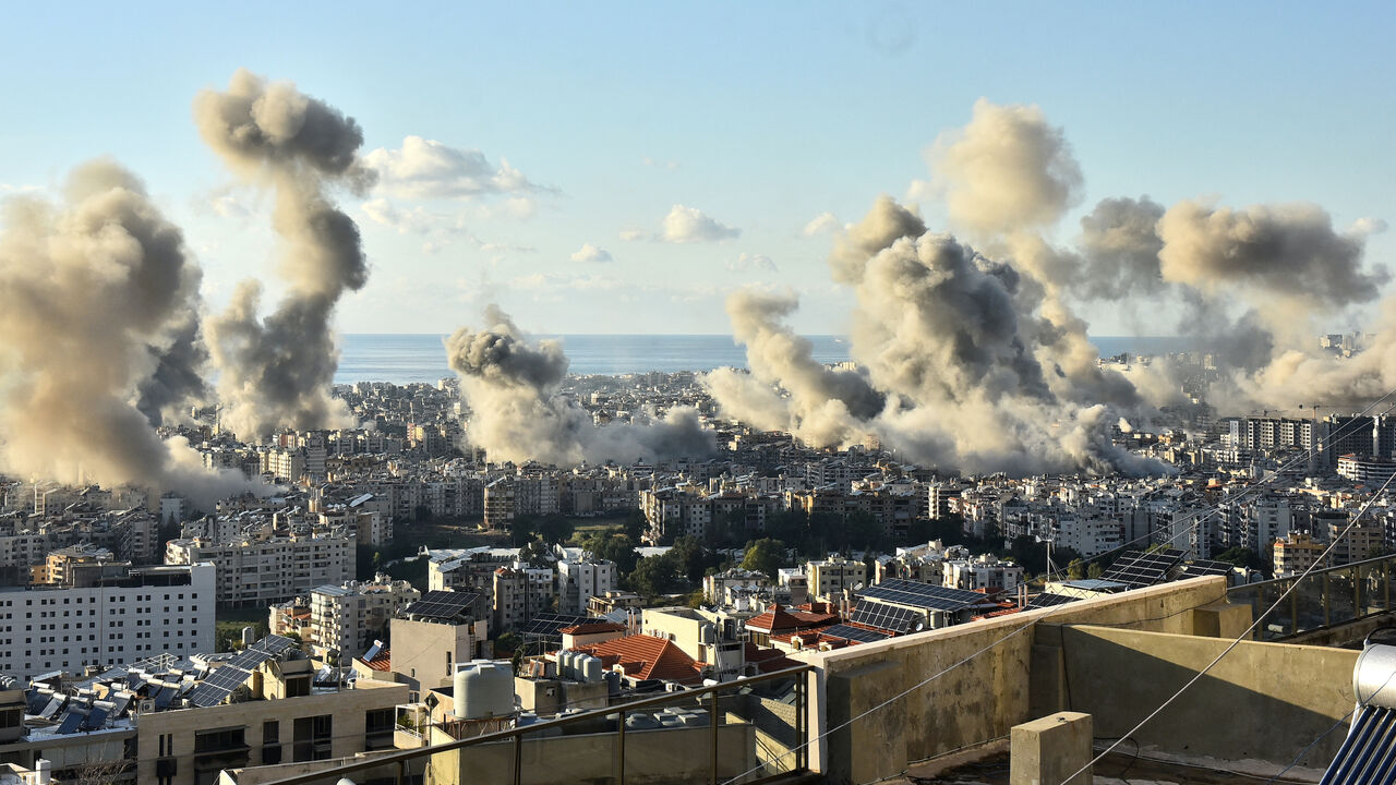 Smoke billows above Beirut's southern suburbs following an Israeli airstrike on Nov. 26, 2024, amid the ongoing war between Israel and Hezbollah. 