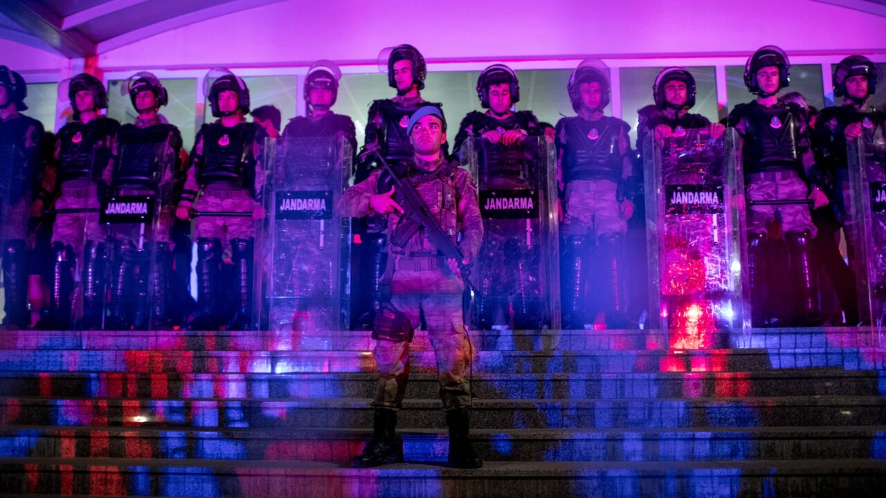 Turkish Jandarma soldiers guard the entrance to the Silivri Courthouse while awaiting the court's decision during the ongoing trial of journalists from the Cumhuriyet newspaper.