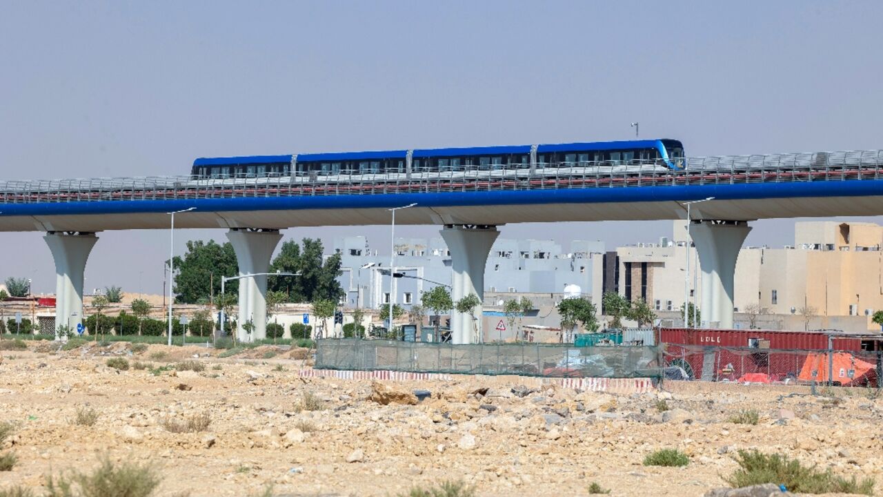 A train is tested ahead of the opening on Sunday of the first three lines of the Riyadh Metro, a major project intended to help shift car-centric Saudi Arabia to public transport.