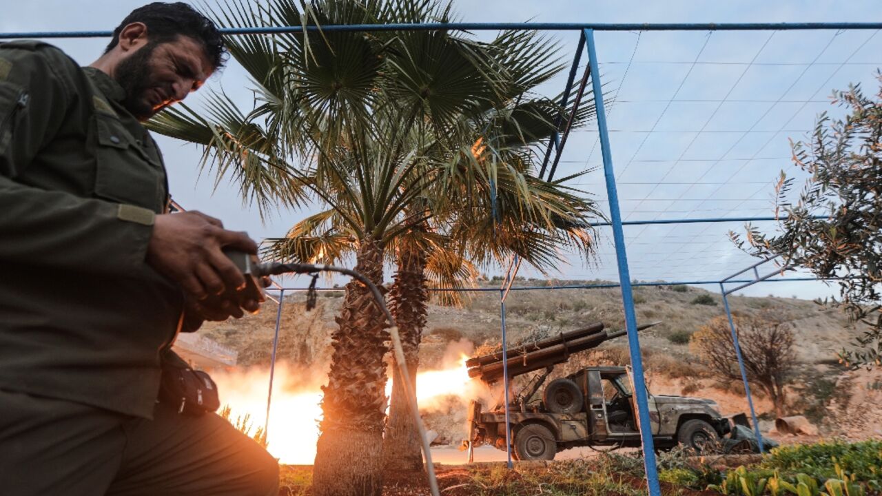 An anti-government fighter remotely fires rockets against regime forces, in the northern outskirts of Syria's central city of Hama