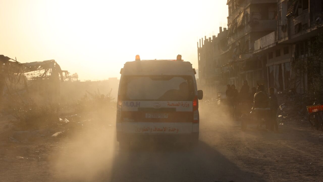 Ambulances transport wounded Palestinians from Kamal Adwan Hospital to Al-Shifa Hospital in Gaza City