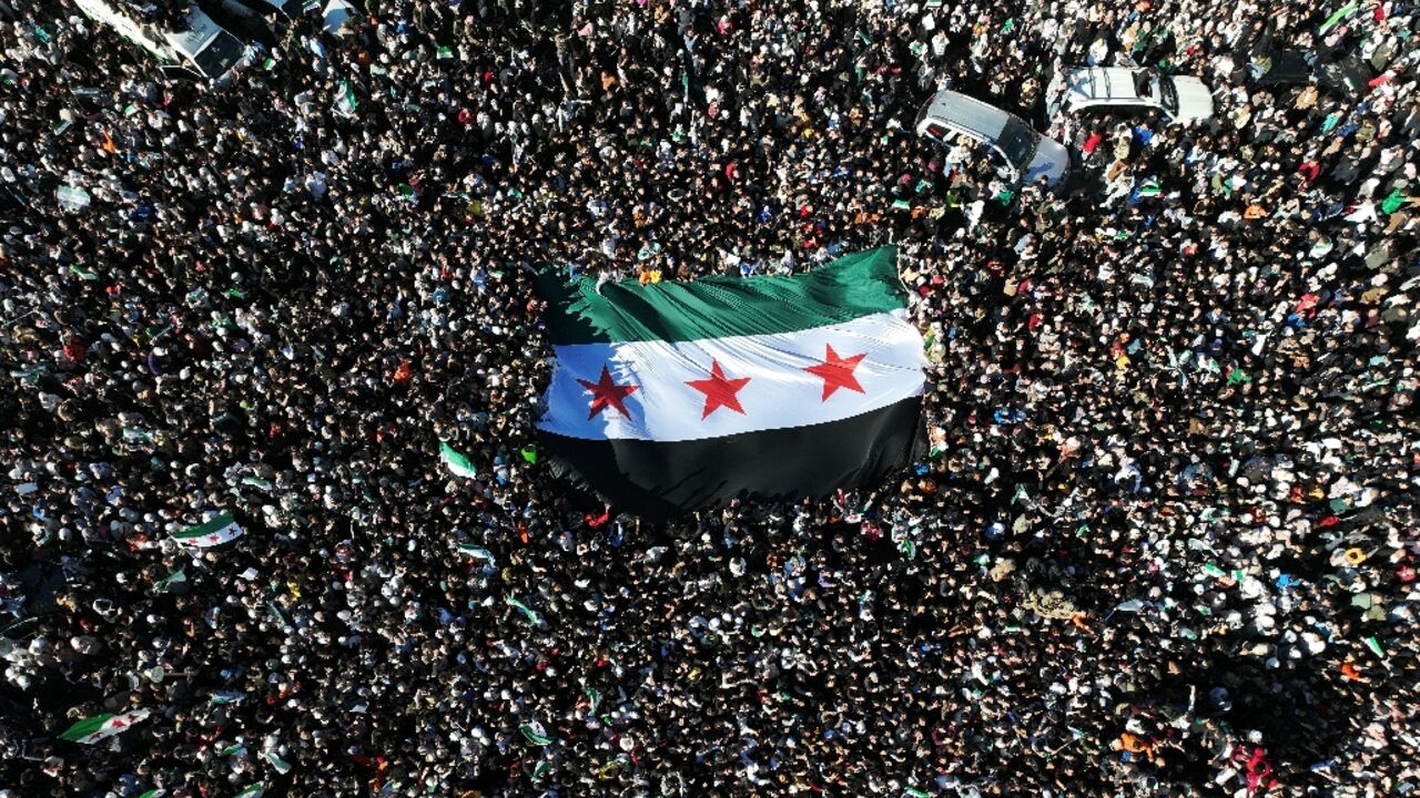 The three-starred flag of Syrian independence has been re-adopted as the new national banner after the overthrown of Assad's regime