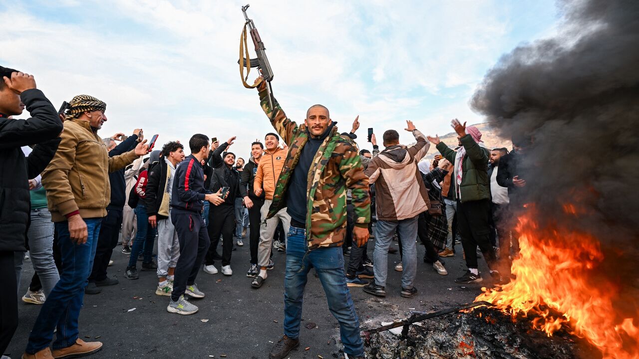 People celebrate the overthrow of President Bashar al-Assad and Baath Party rule, Umayyad Square, Damascus, Dec. 8, 2024.