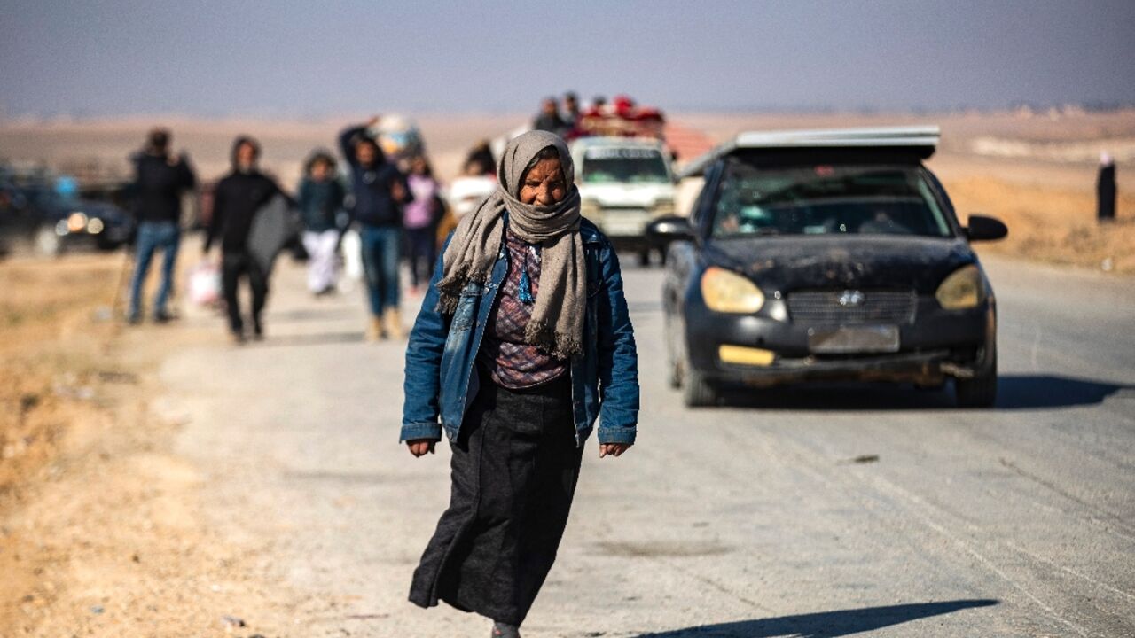 Syrian Kurds fleeing areas north of Aleppo arrive in Tabaqah, on the western outskirts of Raqa