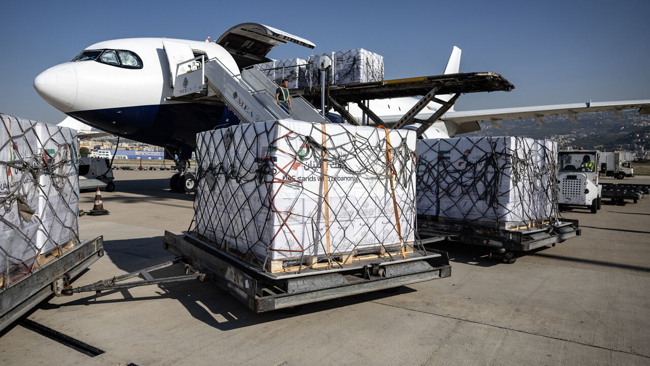 An airport worker unloads humanitarian aid, provided by the UAE, at Lebanon's Beirut international airport on October 28, 2024. (Photo by FADEL SENNA / AFP) (Photo by FADEL SENNA/AFP via Getty Images)