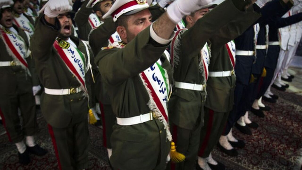EDITORS' NOTE: Reuters and other foreign media are subject to Iranian restrictions on leaving the office to report, film or take pictures in Tehran.

Iranian soldiers shout anti-U.S. slogans during the anniversary ceremony of Iran's Islamic Revolution at the Khomeini shrine in the Behesht Zahra cemetery, south of Tehran, February 1, 2012. REUTERS/Raheb Homavandi  (IRAN - Tags: POLITICS MILITARY ANNIVERSARY)