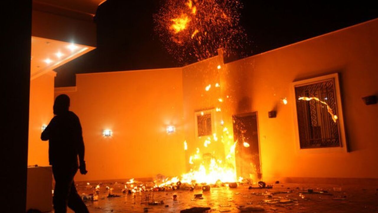 The U.S. Consulate in Benghazi is seen in flames during a protest by an armed group said to have been protesting a film being produced in the United States September 11, 2012. An American staff member of the U.S. consulate in the eastern Libyan city of Benghazi has died following fierce clashes at the compound, Libyan security sources said on Wednesday. Armed gunmen attacked the compound on Tuesday evening, clashing with Libyan security forces before the latter withdrew as they came under heavy fire. REUTER
