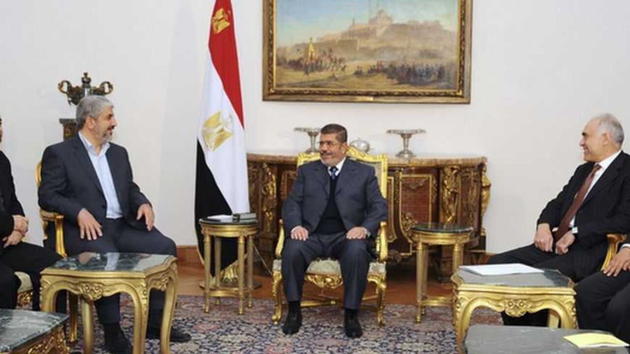 Egyptian President Mohamed Mursi (C) talks with Hamas chief Khaled Meshaal (3rd L) during their meeting in Cairo in this picture provided by the Egyptian Presidency January 9, 2013. REUTERS/Egyptian Presidency/Handout (EGYPT - Tags: POLITICS) ATTENTION EDITORS ? THIS IMAGE WAS PROVIDED BY A THIRD PARTY. FOR  EDITORIAL USE ONLY. NOT FOR SALE FOR MARKETING OR ADVERTISING CAMPAIGNS. THIS PICTURE IS DISTRIBUTED EXACTLY AS RECEIVED BY REUTERS, AS A SERVICE TO CLIENTS